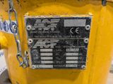 a close up of a yellow fire hydrant with a chain around it