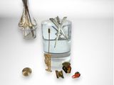 a glass vase with a bunch of different items in it