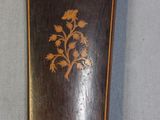 a small wooden box with a floral design on it
