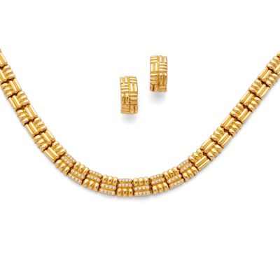 a gold necklace and earring set