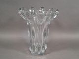 a glass vase that is sitting on a table