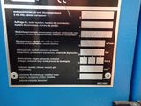 a sign on the side of a blue machine