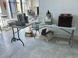 a table with a mixer and other items on it in a room