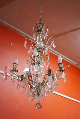 a chandelier hanging from the ceiling in a room