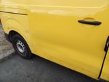 a yellow van parked on the side of the road