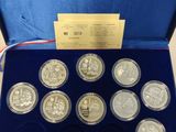 a blue box with six silver coins in it