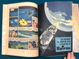 a person holding a comic book open to a page