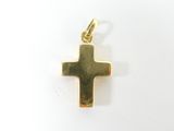 pendentif en forme de croix en or sur fond blanc