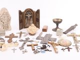 a lot of crosses and other religious items on a white surface