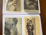 four old postcards of asian women on a wooden table