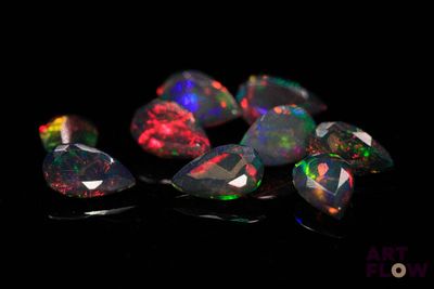 some very pretty colored oplites on a black surface
