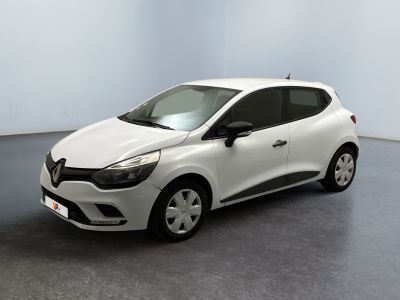 the white car is parked in a room with a gray floor