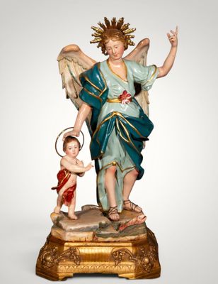 an image of a statue of an angel holding a child
