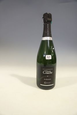 an empty bottle of champagne sitting on top of a white table