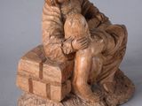 a statue of a man and a woman sitting on a bench
