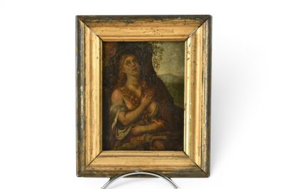 une image d'un tableau représentant une femme tenant un enfant dans ses bras