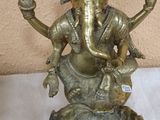 brass statue of an elephant with a heart on it ' s back