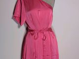 a picture of a pink dress on a mannequin stand