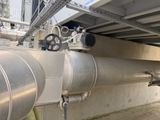 a metal pipe that is connected to a wall