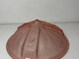 a brown plastic lid on a microwave oven