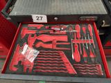 a red tool box with tools inside of it