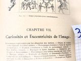 un livre ouvert sur lequel figure un dessin et une feuille de papier sur laquelle est dessinée une image