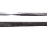 a knife and a pen sitting next to each other