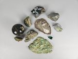 many different types of rocks and stones on the table