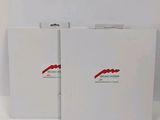 two white folders with a red logo on them sitting next to each other