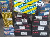 several boxes of assorted skateboards stacked on top of each other