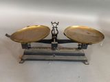 an image of a pair of metal scales on a white surface