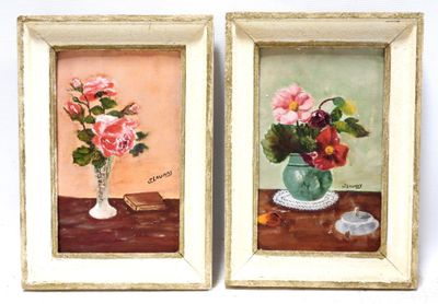 two paintings of flowers in a vase on a table next to a candle