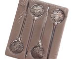 a chocolate mold with spoons and spoons in it