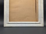 an image of a picture frame with a brown paper in it