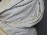 marble bust of a woman draped in a white cloth
