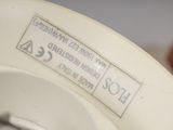 a close up of a toilet bowl with a label on it