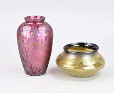 two vases sitting next to each other on a white surface