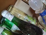 a box full of empty bottles and bottles of wine