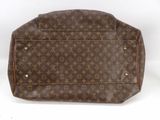 a close up of a brown louis vuitton bag on a white surface