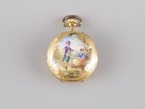 an image of a gold pocket watch with a picture of a man and woman on it