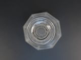 a close up view of a glass bottle with water in it