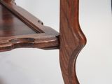 a wooden table with a shelf on top of it