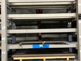a large rack with several shelves in a warehouse