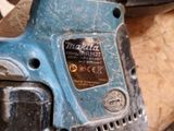 a close up of a cordless drill on a table