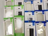 a lot of different boxes of cell phones on the table