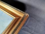 a picture of a painting on a table with a black background