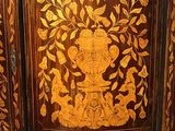 a wooden cabinet with a floral design on it
