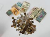 a pile of money sitting on top of a white table