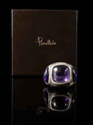 a ring with an amethorate stone in a box