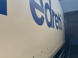 a truck that is parked in front of a building